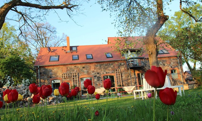 Klosterdorf Maison | Lovingly restored fieldstone barn with fireplace and woodchip heating.