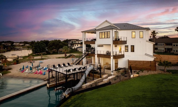 Granite Shoals Maison | Luxurious Lake Retreat: Sleeps 18, King Suites, Pool, Slide, Sun Deck, Elevator