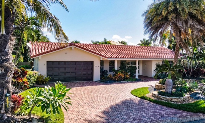 Tropic Isle Maison | Spanish Trail Waterfront Oasis - Luxurious Single Story Home in Delray Beach!