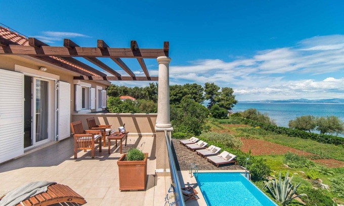 Mirce Villa | Luxury 6-BR Waterfront Villa with Infinity Pool and direct access to a pebble beach