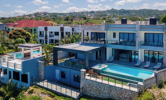 Epworth Villa | Luxury Oceanfront Villa~ Fully Staffed~Pool~Jacuzzi~Movie Theatre