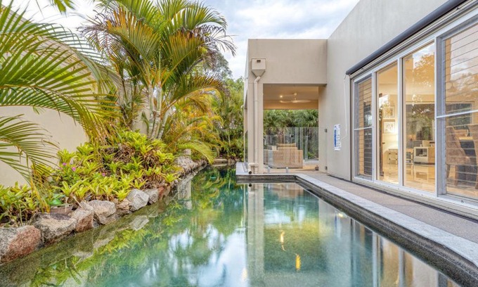 Pelican Waters Maison | Luxury resort style villa pool by Custom Bnb Hosting