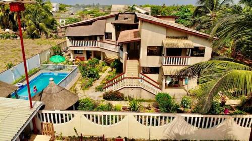 Grand Popo Maison | Maison spacieuse à Grand Popo avec piscine partagée 180 m²
