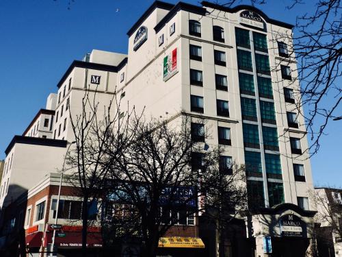 Queens Hôtel | Marco LaGuardia Hotel & Suites