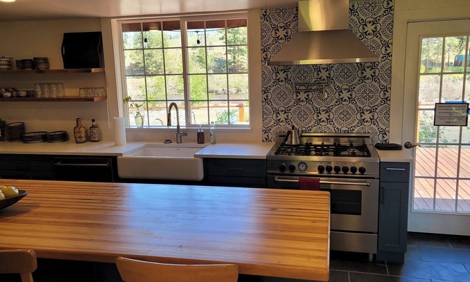 Carlton Maison | METHOW VALLEY RIVER HOUSE W/84' River Deck Sleeps10 Inside, and Pet friendly.