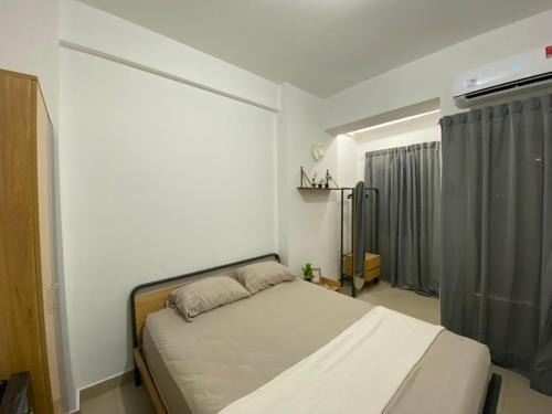 Tangerang Appartement | Minimalist room at The Nest Apartment by Popobella Near Puri Indah West Jakarta