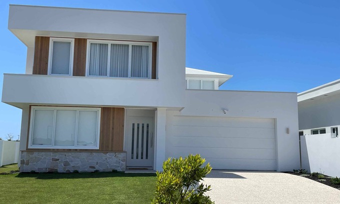 Pelican Waters Maison | Modern Boho Retreat with Pool, Yard & Beaches Just Minutes Away