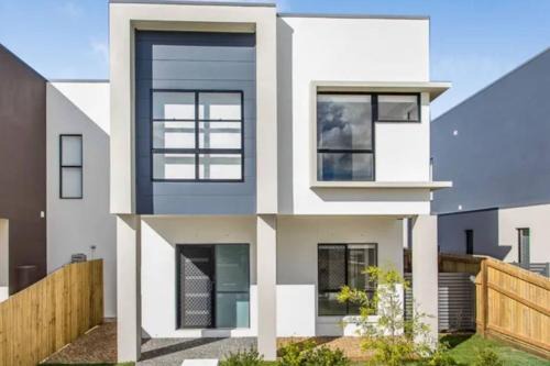 Mango Hill Maison | Modern Elegance Near Lakes Train Parks and Beaches