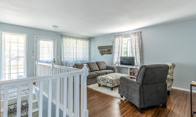 Woods Bay Maison | Mountain-view home with large deck, gas grill, firepit, lawn, and central AC