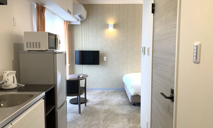 Makishi Appartement | Mr.KINJO Miki24 in front of Makishi Station