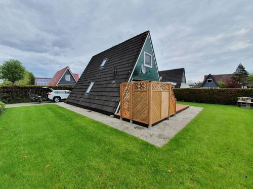 Carolinensiel Maison | Murmel 4 - Strandkorb, Wallbox, WLan, Kamin