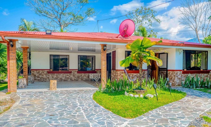 Garabito Maison | Palm-lined paradise with a pool, wood stove, & mountain views - dog-friendly