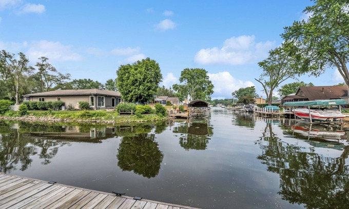 McHenry Maison | Peaceful and Relaxing Water Front Home with Outdoor Pool Sleeps 12