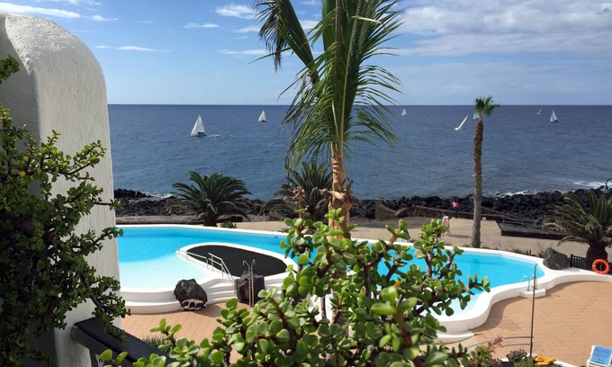 Costa Teguise Copropriété | Penthouse avec vue sur la mer, super conditionné, piscine chauffée, la saison de l'année.