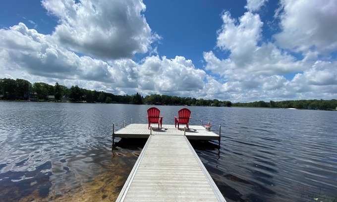 Penn Lake Park Maison | Pocono Lakefront Home- with Private Dock & Swim Raft, Fire Pit, & Boats!