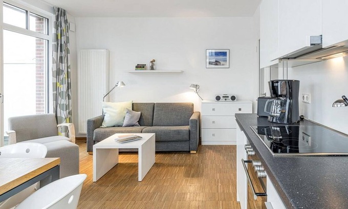 Horum Appartement | Pretty vacation apartment with sunny balcony in south-east location - only 100 m to the beach - Ferienvillen Anna