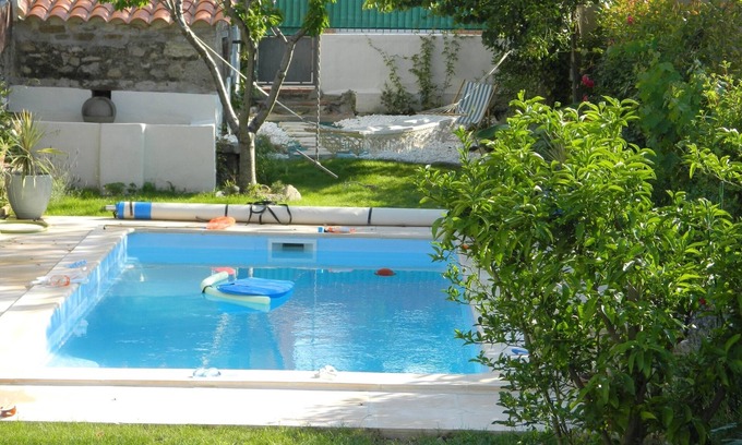 Saint-Genis Maison | Pretty village house with private pool in rear garden. Opposite historic church.