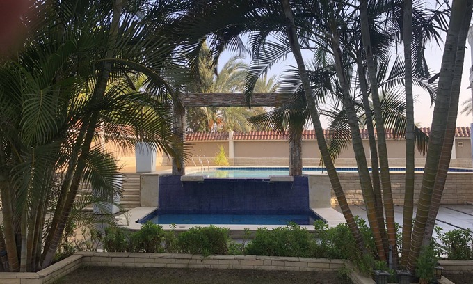 Al-'Amriyah Copropriété | Private resort type condo setting with full access to garden and pool