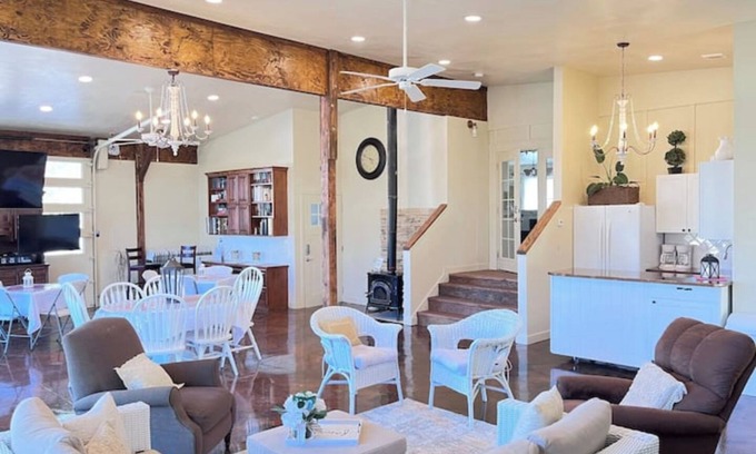 Nampa Autre | Red Roof Farmhouse has beds for 27, a 12 person swim spa, 1350 sq ft activity rm