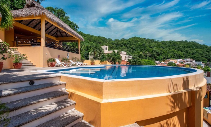Crucecita Maison | Relax in this spacious home in a quiet community with shared pool and BBQ area