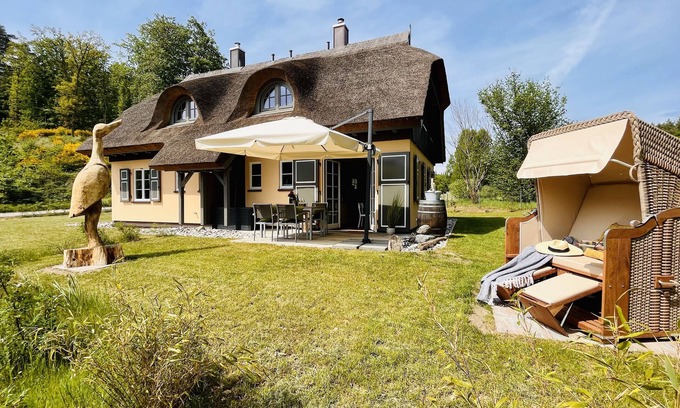 Putbus Maison | Relaxation by the water: Holiday home Herrlichkeit 1 in the Klein Stresow vacation village