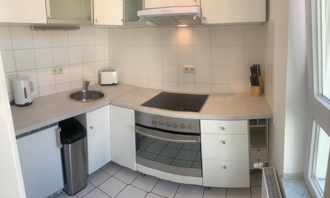 Suelz Appartement | Renovated modern 2-room apartment with balcony and underground parking near the university