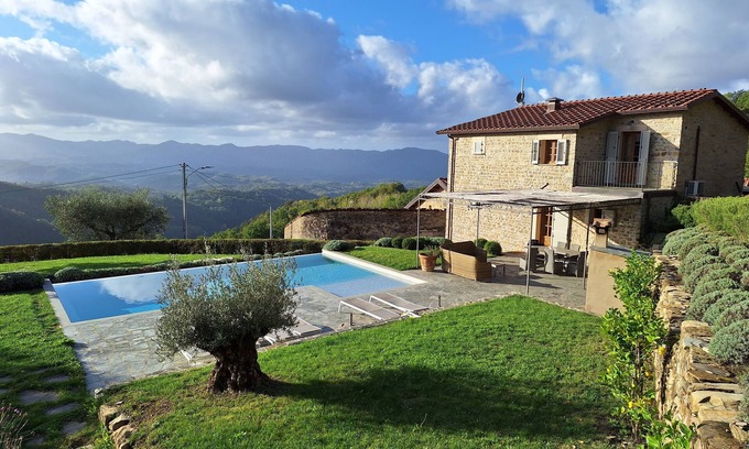 Licciana Nardi Maison | Restored Farmhouse With Infinity Pool, Mountain Views and Landscaped Garden