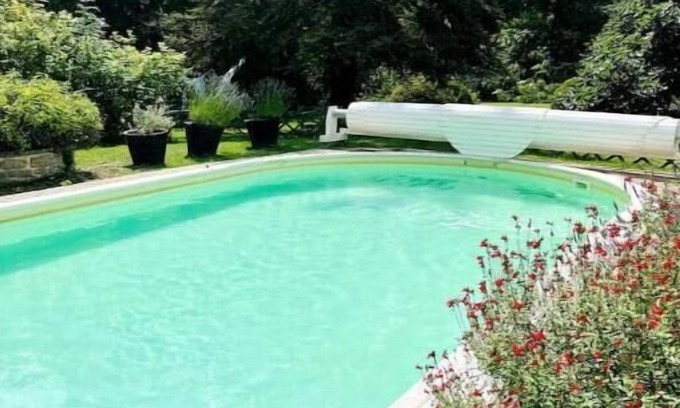 Aulnay-la-Riviere Maison | Riverfront pool and sauna house in a flower-filled park