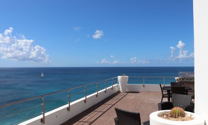 Maho Appartement | 7e étage Blue Residence - exquis, moderne, vue sur la mer des Caraïbes. à partir de 390 $