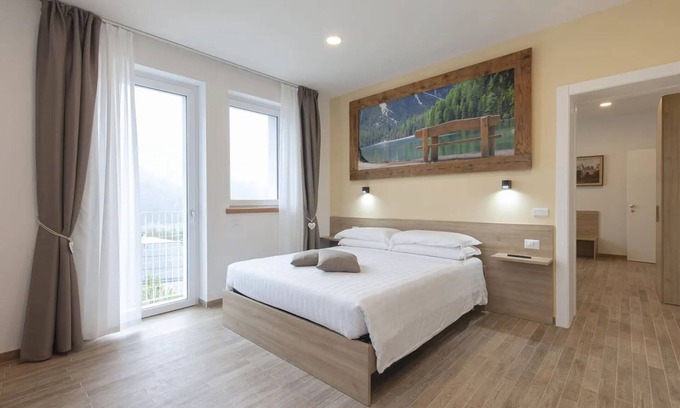 Domegge di Cadore Appartement | Chambre 'Camera G Beige' avec vue sur le lac, terrasse partagée et Wi-Fi