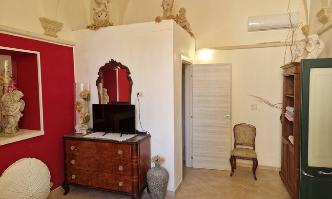 San Donato di Lecce Appartement | Chambre 'Palazzo Costantini - Girasole' avec Terrasse partagée, Wi-Fi et Climatisation