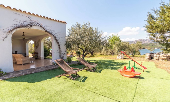 Cala Liberotto Villa | Villa rustique avec Wi-Fi, climatisation et beau jardin