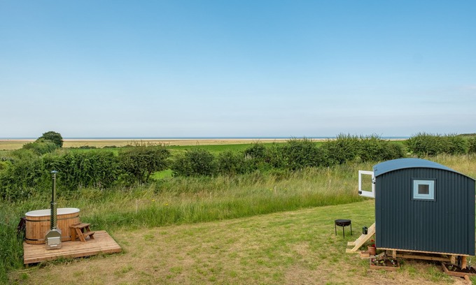 Wells-next-the-Sea Cabine | This bespoke hut is situated on the edge of the marsh with uninterrupted views out to the sea.