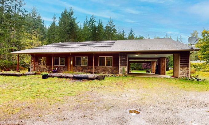 Port Orchard Maison | Scenic dog-friendly home with forest views, firepit, wood stove, & W/D