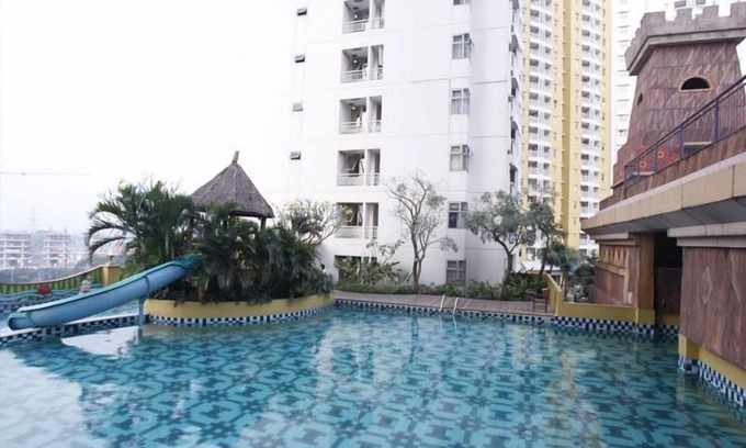 Panunggangan Utara Appartement | Simply Studio Room at Grand Serpong Apartment By Travelio