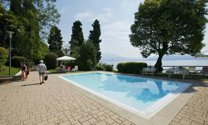 Gonte Appartement | Spacieux appartement de 2 chambres avec deux balcons, piscine et accès au lac