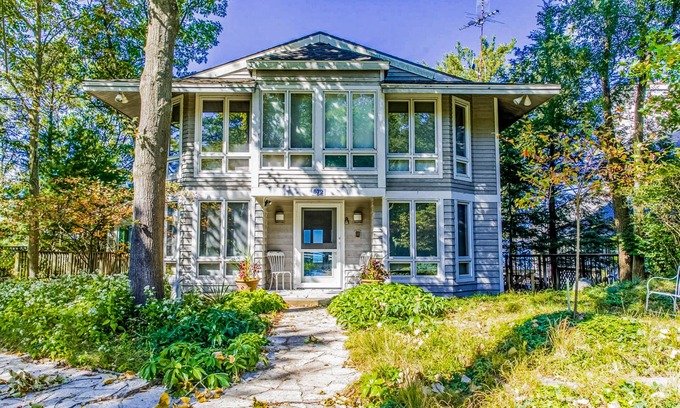 Shorewood-Tower Hills-Harbert Maison | Spacious lakefront home with private beach, hot tub, fire table, & views