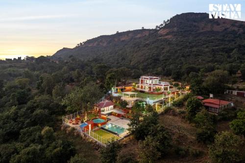 Panhala Villa | StayVista at The Redstone Villa with Bar, Lawn & Pool