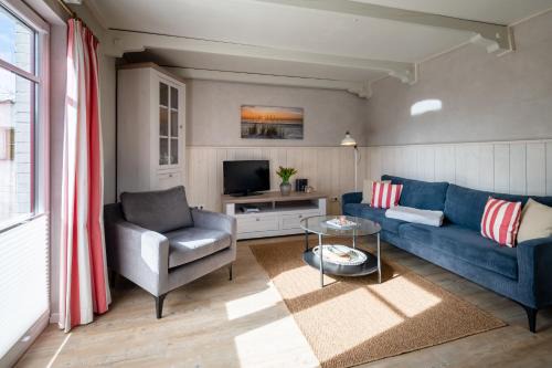 Suederhafen Appartement | Stilvolles Kapteins Cottage mit Kamin - Inge