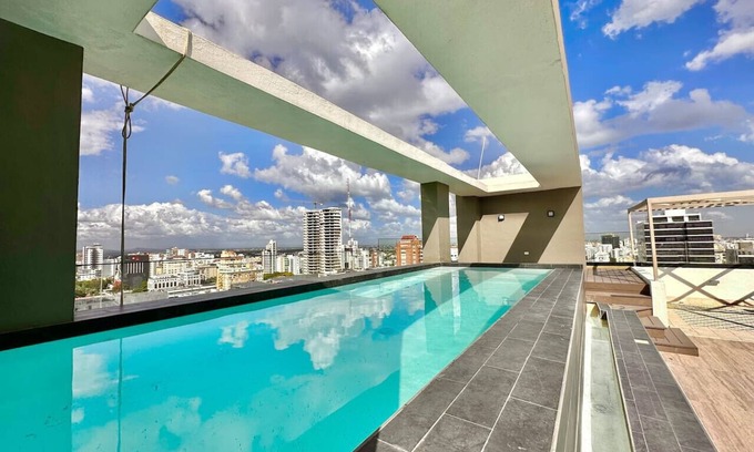 Yolanda Morales Copropriété | Stunning City Center Condo Full AC, Pool, Near All