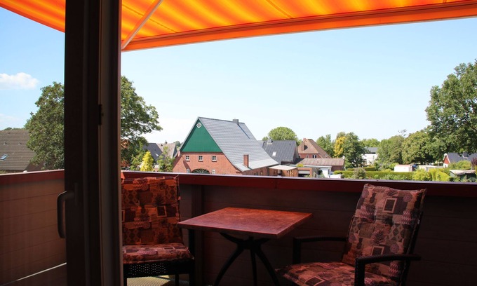 Wremen Copropriété | Superior maisonette with balcony and air conditioning in the North Sea resort of Wremen