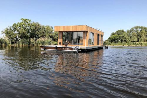 Oud Ade Location De Bateaux | Surla houseboat "Nevel" Kagerplassen with tender