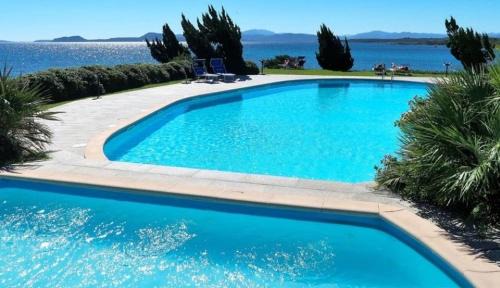 Baia Caddinas Appartement | Swimming pool & Beach access Residence