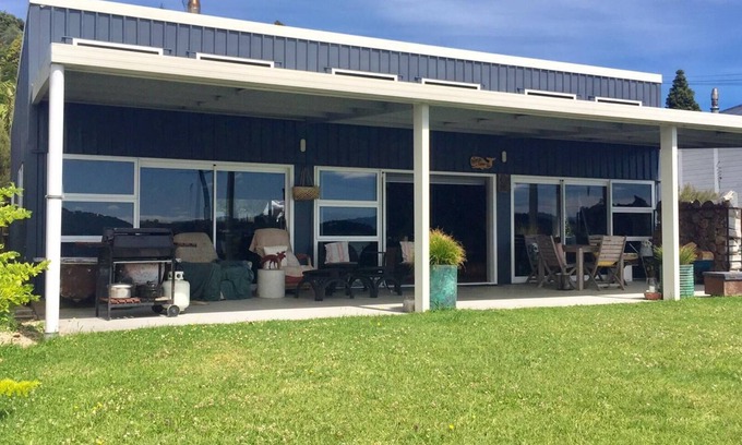 Taharoa Maison | Te Waitere Village spectacular water views of harbour and surrounding hillsides.