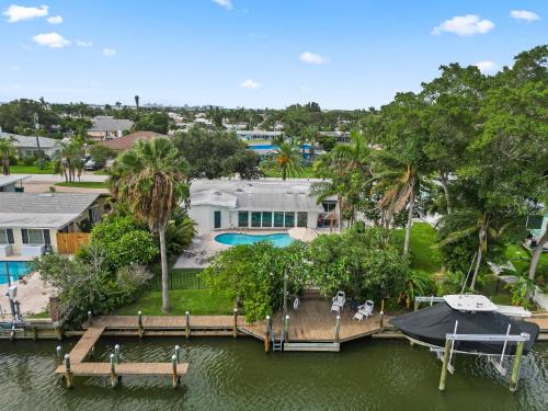 Venetian Way Maison | The Cocoa Plum - A Quiet Riverfront Pool Home Near Beach