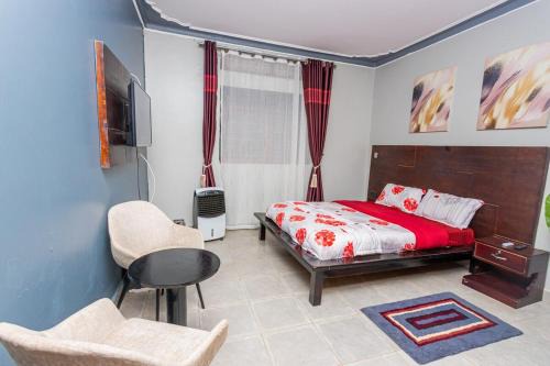 Soroti Appartement | The Den Soroti Red & White