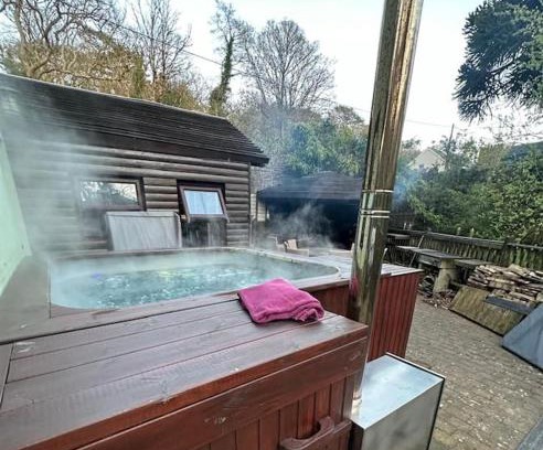 Foxdale Maison | The hot tub by the waterfall - facilities included