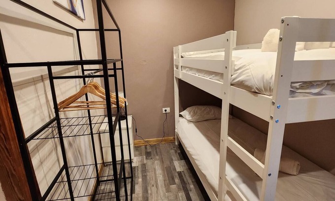 Vilaflor Appartement | This room is a bunk room with two single bunk beds. The bathroom and showers are shared with the two other bunk rooms . The room has a great view of the village square.