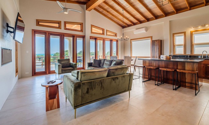 Caye Caulker Villa | Tropical retreat with a pool, dock, bikes, canoes, balconies, and 360 views