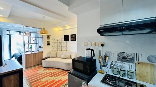 Central Province Appartement | UN approved snug studio with gym